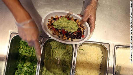 MIAMI, FL - APRIL 27:  Chipotle restaurant workers fill orders for customers on the day that the company announced it will only use non-GMO ingredients in its food on April 27, 2015 in Miami, Florida.  The company announced, that the Denver-based chain would not use the GMO&#39;s, which is an organism whose genome has been altered via genetic engineering in the food served at Chipotle Mexican Grills.  (Photo by Joe Raedle/Getty Images)