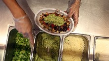 MIAMI, FL - APRIL 27:  Chipotle restaurant workers fill orders for customers on the day that the company announced it will only use non-GMO ingredients in its food on April 27, 2015 in Miami, Florida.  The company announced, that the Denver-based chain would not use the GMO's, which is an organism whose genome has been altered via genetic engineering in the food served at Chipotle Mexican Grills.  (Photo by Joe Raedle/Getty Images)