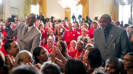 John Carlos, left, and Tommie Smith stand as they are recognized by President Barack Obama during a White House ceremony Thursday.