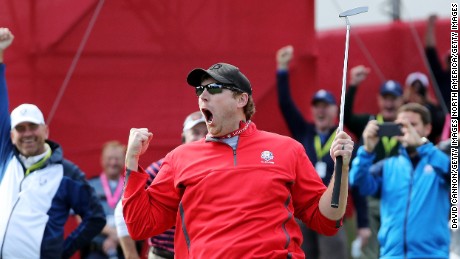 Fan David Johnson reacts after being pulled from the crowd and making a putt on the sixth green during practice prior to the 2016 Ryder Cup.