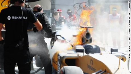 The car of Kevin Magnussencatches fire during practice for the Malaysian Grand Prix.