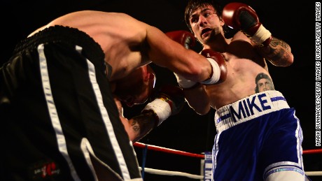 Boxer Mike Towell, right, takes on Danny Little in a 2015 welterweight match in Glasgow, Scotland.