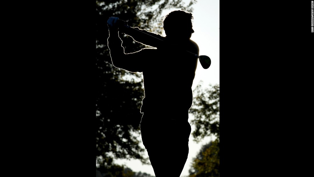 Rory McIlroy of Europe hits off the range during morning foursome matches.