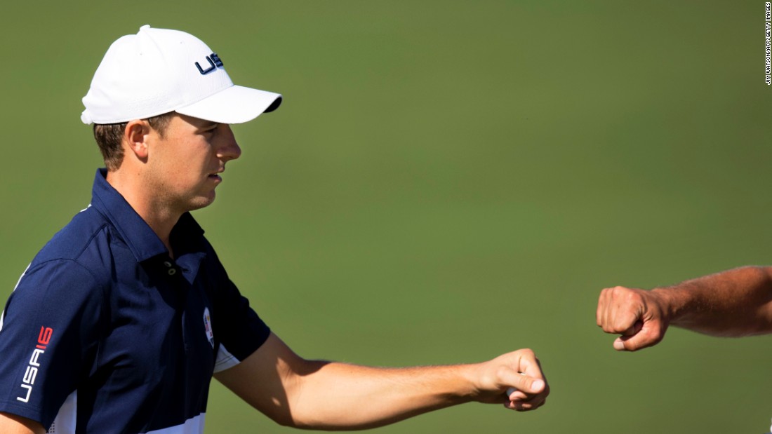 Team USA&#39;s Jordan Spieth fist bumps his caddy Michael Greller during the singles matches. He eventually lost to Henrik Stenson in a rare last day win for Europe.