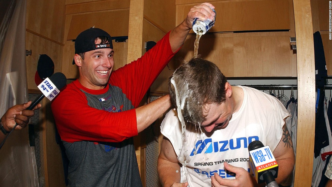 Chipper Jones is doused by Jeff Francoeur in the locker room after defeating the Colorado Rockies to win the Braves&#39; 14th consecutive division title on September 27, 2005, at Turner Field. The Braves beat the Rockies 12-3.  