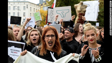 Polish women take part in a nationwide strike and demonstration to protest against a legislative proposal for a total ban of abortion on October 3, 2016 in Warsaw.