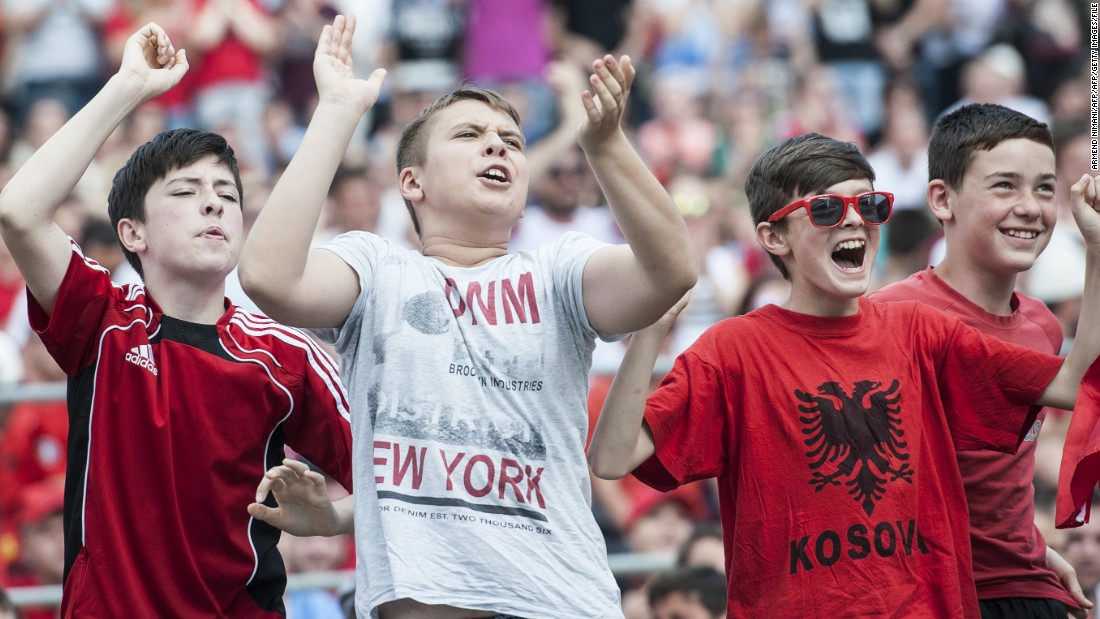 Albania&#39;s qualification for Euro 2016 was popular with fans in Kosovo. Here young boys watch the match against Switzerland on a big screen in the capital Pristina. 