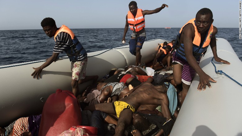 Migrants step over dead bodies while being rescued in the Mediterranean Sea, off the coast of Libya in October 2016.  Agence France-Presse photographer Aris Messinis &lt;a href=&quot;http://www.cnn.com/2016/10/06/europe/migrant-boats-libya-aris-messinis/index.html&quot; target=&quot;_blank&quot;&gt;was on a Spanish rescue boat&lt;/a&gt; that encountered several crowded migrant boats. Messinis said the rescuers counted 29 dead bodies -- 10 men and 19 women, all between 20 and 30 years old. &quot;I&#39;ve (seen) in my career a lot of death,&quot; he said. &quot;I cover war zones, conflict and everything. I see a lot of death and suffering, but this is something different. Completely different.&quot;