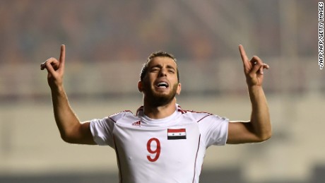 Mahmoud Al-Mawas celebrates his winning goal against China in World Cup qualifying.