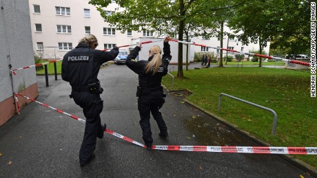 Police secure a residential area in Chemnitz, Germany, after explosives were found in an apartment.