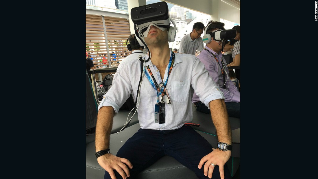 A Formula E fan tries out the latest Virtual Reality technology at the Jaguar entertainment stand.