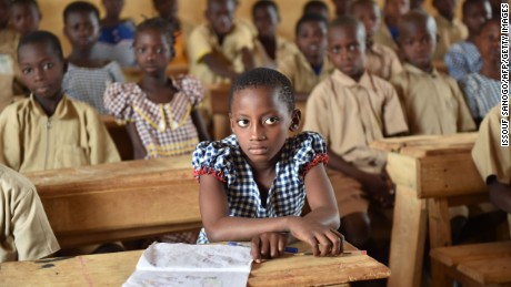 This photo taken on March 7, 2016 shows pupils in a classroom of the first elementary school built in 2013 by Swiss group Nestle, in the village of Goboue, in the southwest of Ivory Coast. 
&quot;At five years old, I went to work in the fields with my dad. Today, my children go to school,&quot; said Peter, a cocoa farmer in Bonikro in the centre of Ivory Coast. Peter is one of a generation of farmers at the heart of a drive to keep the country&#39;s children in school and away from its vast plantations. / AFP / ISSOUF SANOGO        (Photo credit should read ISSOUF SANOGO/AFP/Getty Images)