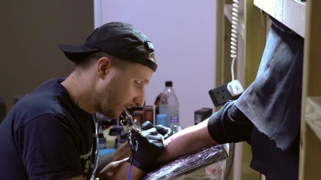 Famed tattoo artist gives away free mystery tattoos | CNN