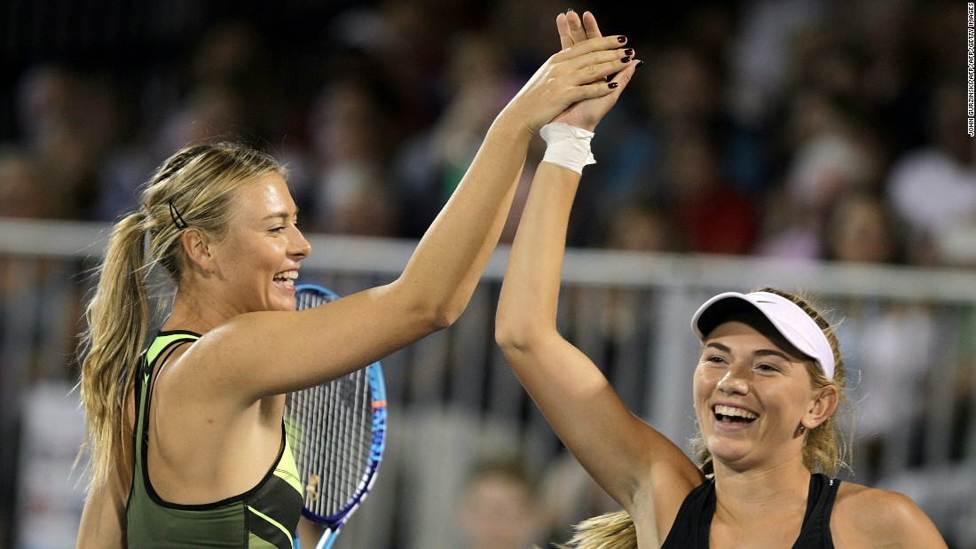 Maria Sharapova celebrates with her partner, 16-year-old Taylor Johnson, at the World Team Tennis Smash Hits charity tennis event in Las Vegas.