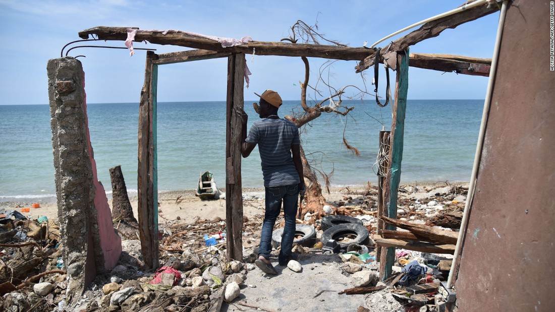 A man stands in the remnants of a house destroyed by Hurricane Matthew in the southern town of Les Cayes on Monday, October 10. Matthew wreaked havoc in Haiti, killing hundreds, destroying homes and knocking out electricity in the impoverished Caribbean nation. More than 1.4 million people are in need of urgent assistance, a UN official says.
