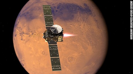 Artist&#39;s impression visualising the ExoMars 2016 Trace Gas Orbiter (TGO), with its thrusters firing, beginning its entry into Mars orbit on 19 October 2016