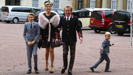 Rod Stewart arrives at Buckingham Palace with his wife, Penny Lancaster and their two children on Tuesday, October 11.