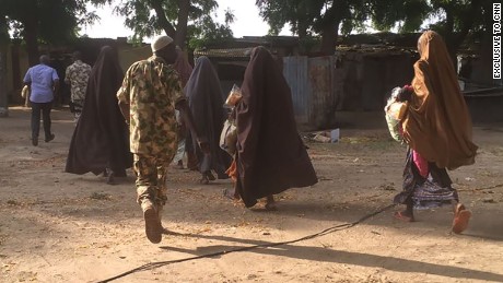 This photo, obtained exclusively by CNN, shows some of the 21 girls who were released to the Nigerian military Thursday morning in Nigeria.