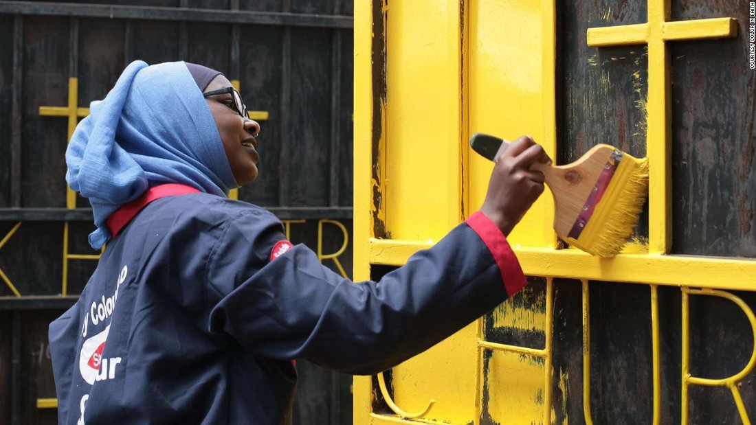 The yellow lick of paint serves as a striking symbol of unity and peace between Muslims and Christians.