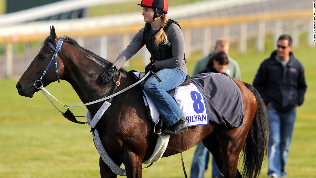 Moore is no stranger to the highest level of the sport, here riding out Mourilyan in preparation for the 2009 Melbourne Cup. She was a strapper for the horse -- trained by her father -- which placed third.