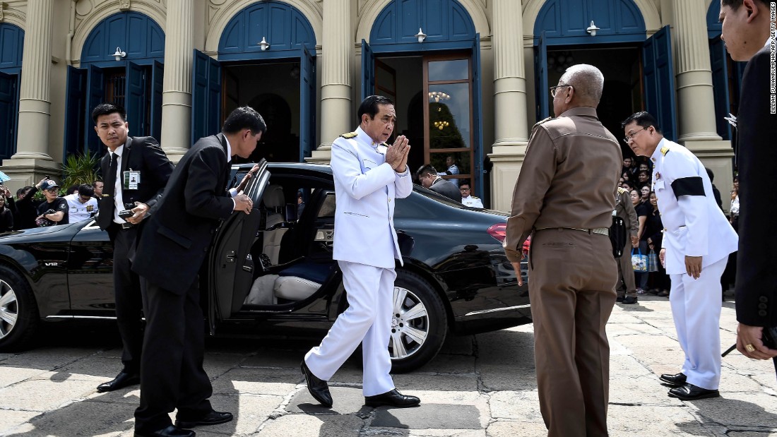 The Prime Minister arrives to pay respects to the late King at the Grand Palace on October 14.