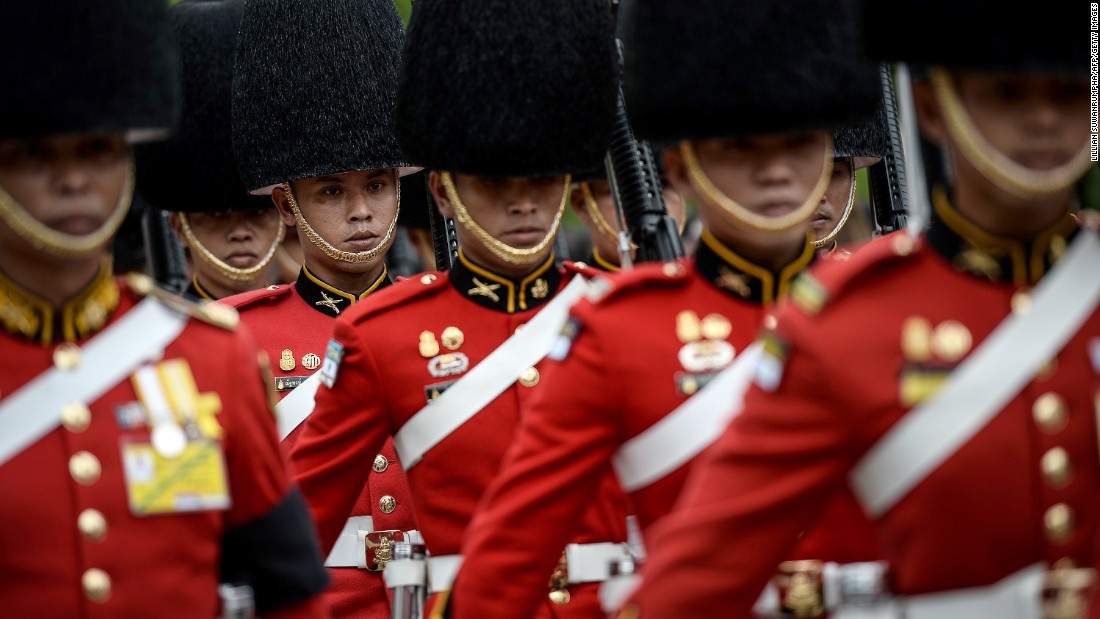 The Thai Royal Guard marches in honor of Thai King Bhumibol Adulyadej on Friday.