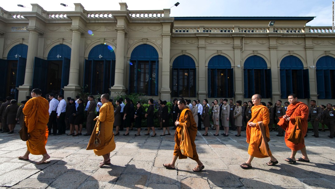 Buddhist monks line up to offer condolences at the Grand Palace in Bangkok on Friday.