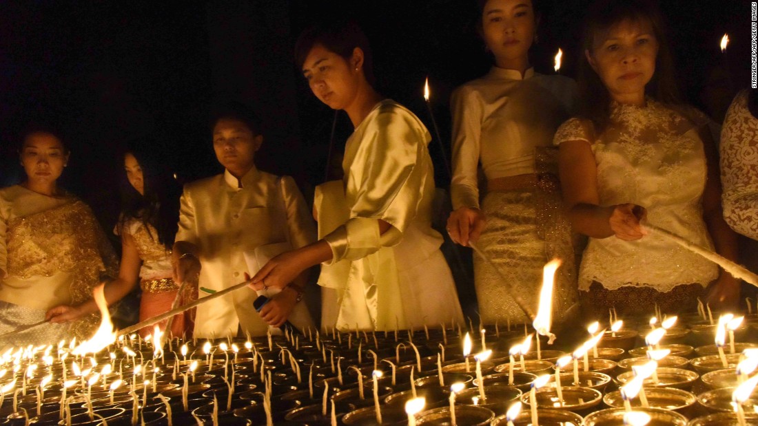 Devotees light candles for the late Thai King  at Mahabodhi temple in Bodhgaya on October 14.