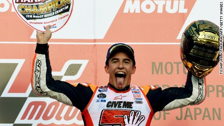 Spain&#39;s Marc Marquez celebrates his title winning victory at the Japanese MotoGP at Motegi.