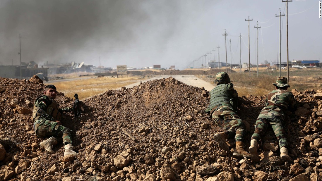 Kurdish security forces take up a position near ISIS-controlled villages on Monday, October 17.