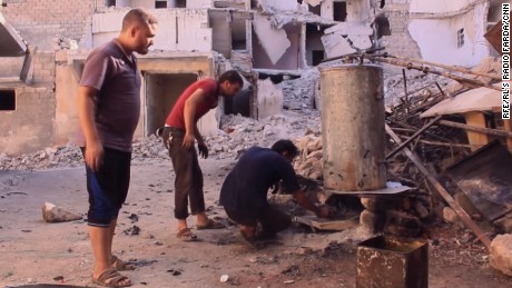 Aleppo residents use an old boiler to make fuel out of plastic.