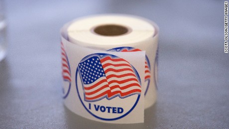 A roll of &quot;I Voted&quot; stickers, which are handed out to residents after they vote, sit on an election officials table at a polling place on November 4, 2014 in Ferguson, Missouri.  In last Aprils election only 1,484 of Ferguson&#39;s 12,096 registered voters cast ballots. Community leaders are hoping for a much higher turnout for this election. Following riots sparked by the August 9 shooting death of Michael Brown by Darren Wilson, a Ferguson police officer, residents of this majority black community on the outskirts of St. Louis have been forced to re-examine race relations in the region and take a more active role in the region&#39;s politics. Two-thirds of Fergusons population is African American yet five of its six city council members are white, as is its mayor, six of seven school board members and 50 of its 53 police officers.  (Photo by Scott Olson/Getty Images)