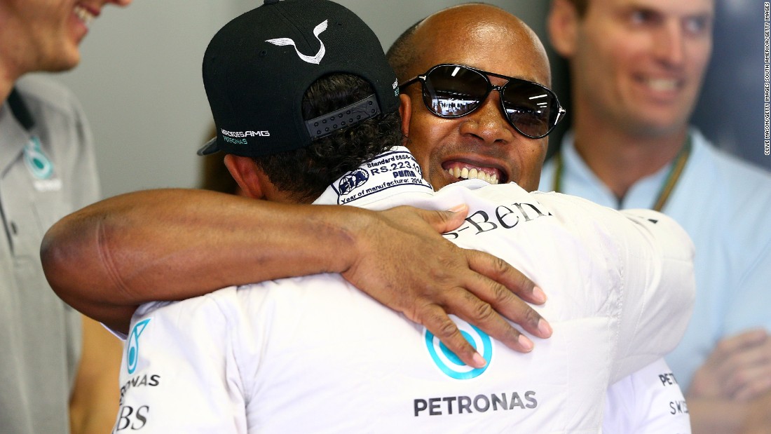 Father and son celebrate Lewis&#39; second F1 world championship in 2014.