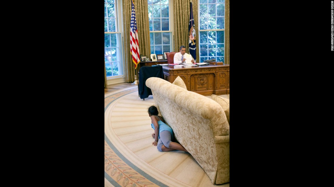 Sasha Obama hides behind an Oval Office sofa as she sneaks up on her father on August 5, 2009. Sasha was 7 when her father took office. Malia was 10. &lt;a href=&quot;http://www.cnn.com/2012/09/05/politics/gallery/sasha-and-malia-2008-present/index.html&quot; target=&quot;_blank&quot;&gt;See more pictures of Malia and Sasha Obama since their father was elected President&lt;/a&gt;