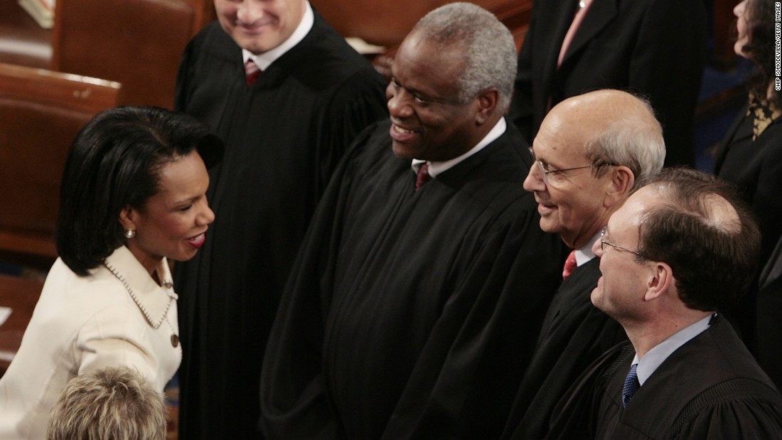 Thomas stands next to Supreme Court Justice Samuel Alito as Alito shakes hands with Secretary of State Condoleezza Rice prior to the State of the Union speech in January 2006.