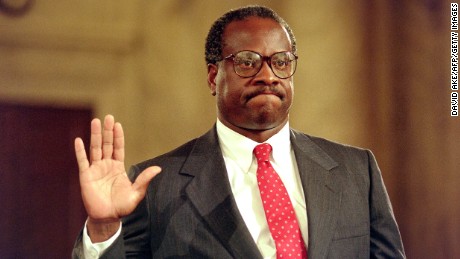 US Supreme Court nominee Clarence Thomas raises his right hand as he is sworn in on Sept. 10, 1991, during confirmation hearings before the US Senate Judiciary Committee, in Washington, DC.