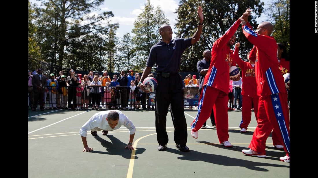 Obama does pushups on the White House basketball court after a member of the Harlem Globetrotters made a shot on April 9, 2012.