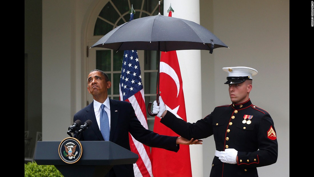 Obama looks to see if it&#39;s still raining at a White House news conference on May 16, 2013.
