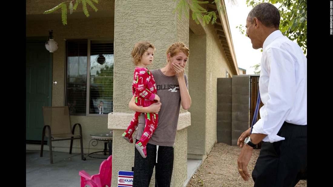 Obama greets locals in Phoenix after touring a model home of a nonprofit&#39;s housing development on January 8, 2014.