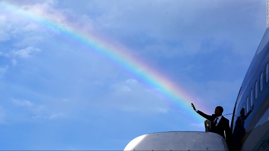 Obama&#39;s wave aligns with a rainbow as he boards Air Force One in Kingston, Jamaica, on April 9, 2015.