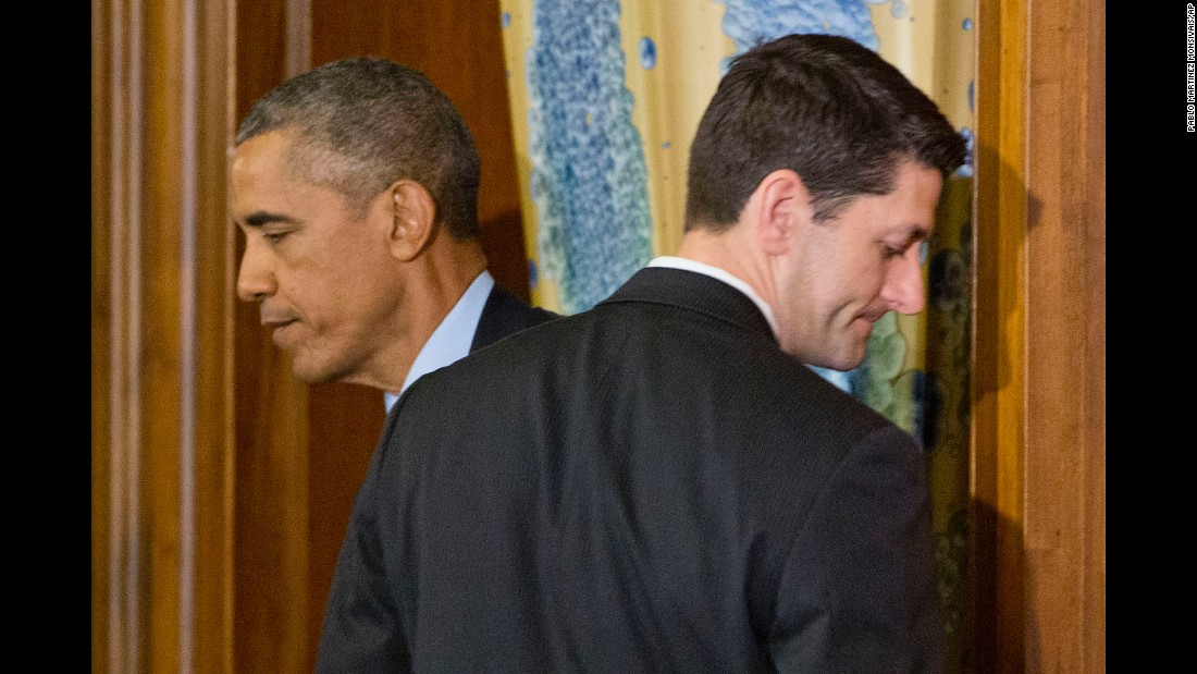 Obama walks past House Speaker Paul Ryan in Washington during a St. Patrick&#39;s Day lunch with Irish Prime Minister Enda Kenny on March 15, 2016.