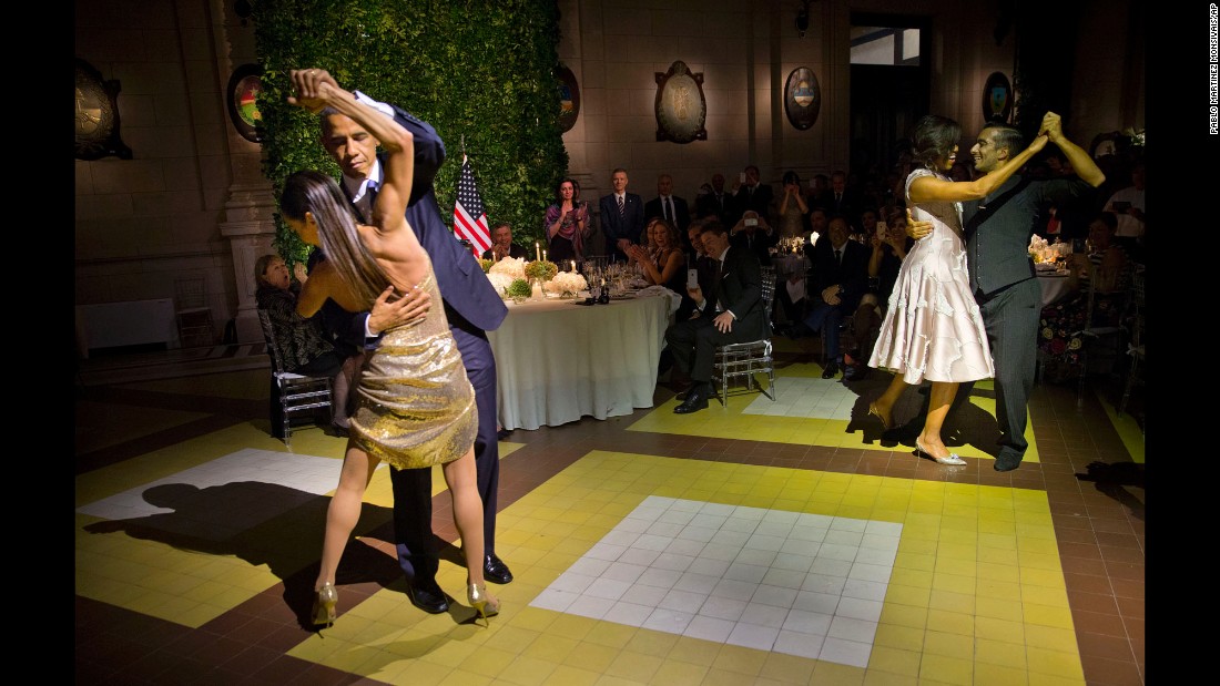Obama, left, and first lady Michelle Obama, right, tango with dancers during a state dinner in Buenos Aires on March 23, 2016.