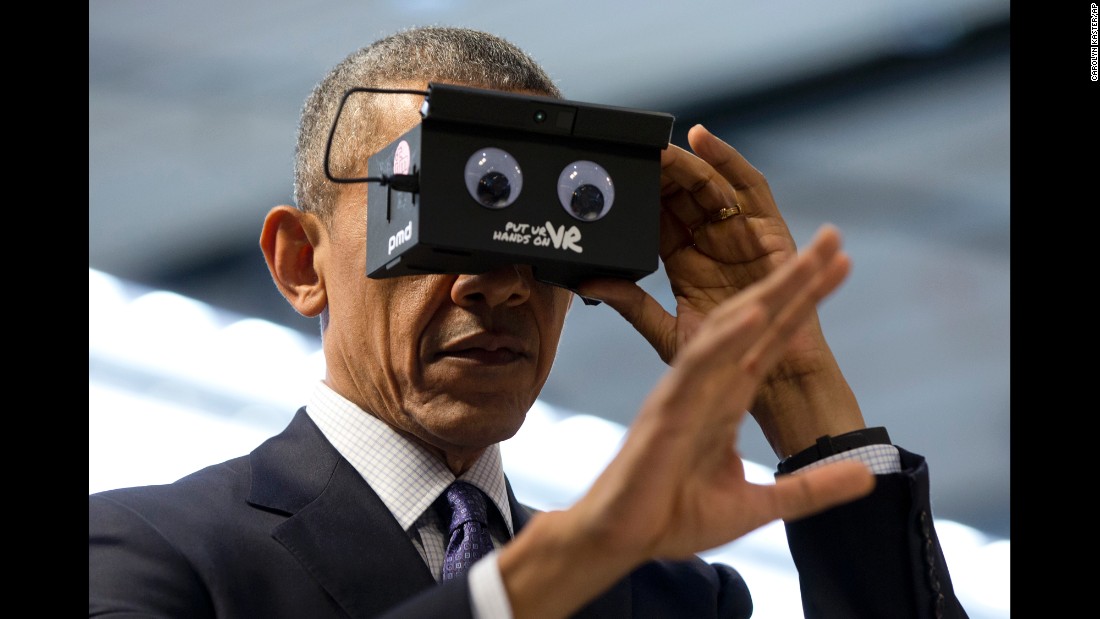 Obama tests virtual-reality goggles during a trade fair in Hanover, Germany, on April 25, 2016.