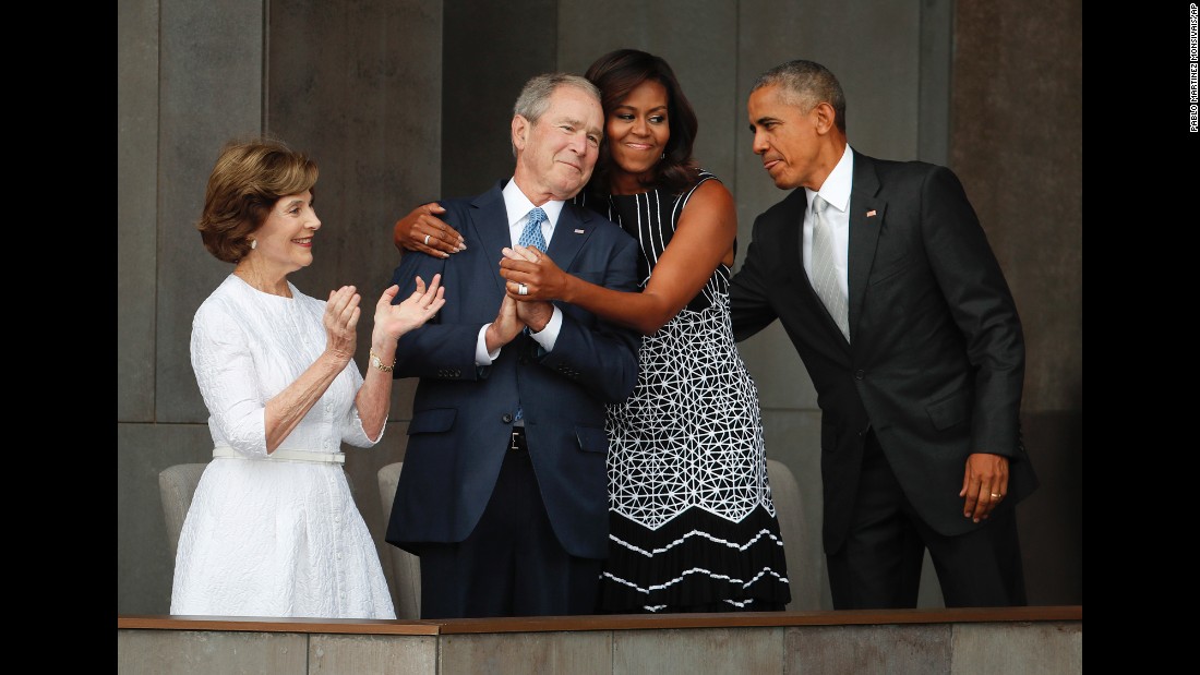 First lady Michelle Obama hugs former U.S. President George W. Bush during &lt;a href=&quot;http://www.cnn.com/2016/09/23/politics/smithsonian-african-american-museum-obama/&quot; target=&quot;_blank&quot;&gt;the dedication ceremony&lt;/a&gt; of the new Smithsonian museum devoted to African-American history. The museum opened in Washington on September 24, 2016. &lt;a href=&quot;http://www.cnn.com/2016/09/24/politics/michelle-obama-george-w-bush-friendship/&quot; target=&quot;_blank&quot;&gt;Read more: The friendship of Michelle Obama and George W. Bush&lt;/a&gt;