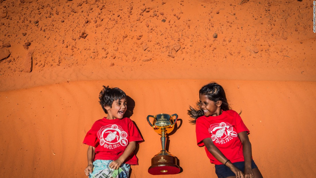 Siblings Dominic (aged five) and Zuleeyah (aged eight) Treacy with the 2016 Emirates Melbourne Cup at Gantheaume Point in Broome, Western Austria.