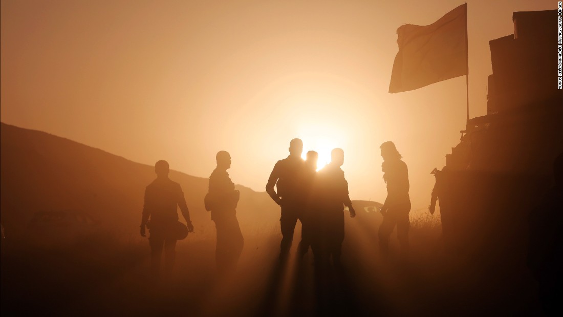 Kurdish Peshmerga forces take positions as they start to move toward the Imam Reza and Tizxirab villages of the Bashiqa district on Sunday, October 23.