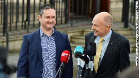 Gareth Lee, left, speaks outside Belfast high court Monday with Michael Wardlow of the Equality Commission.