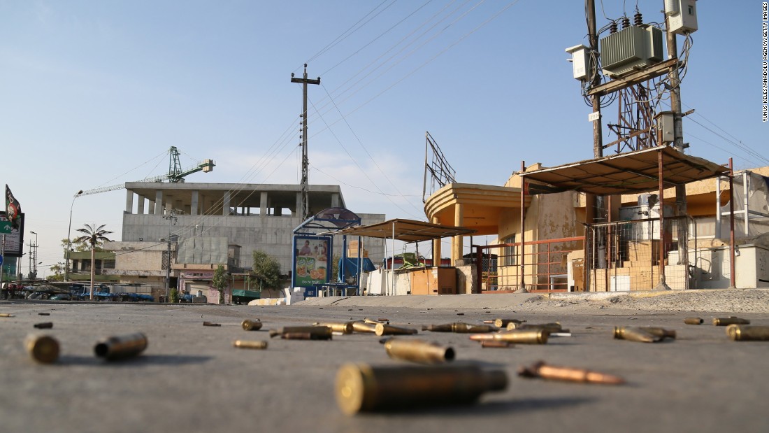 Spent bullet cartridges litter the street around the Jihad Hotel, where ISIS militants battled Iraqi security forces in Kirkuk on Friday, October 21.