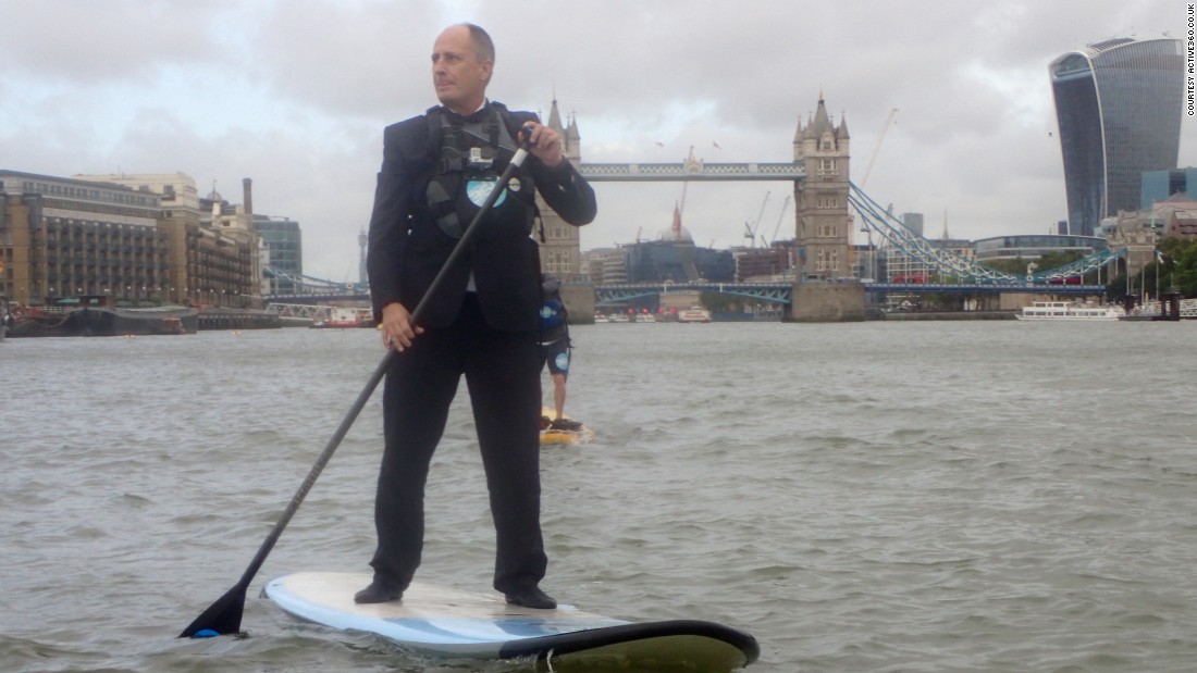 In London Andy Mitchell, the CEO of Tideway Tunnel, a sewer project for the River Thames, is pictured paddle boarding in front of the city&#39;s historic Tower Bridge. 