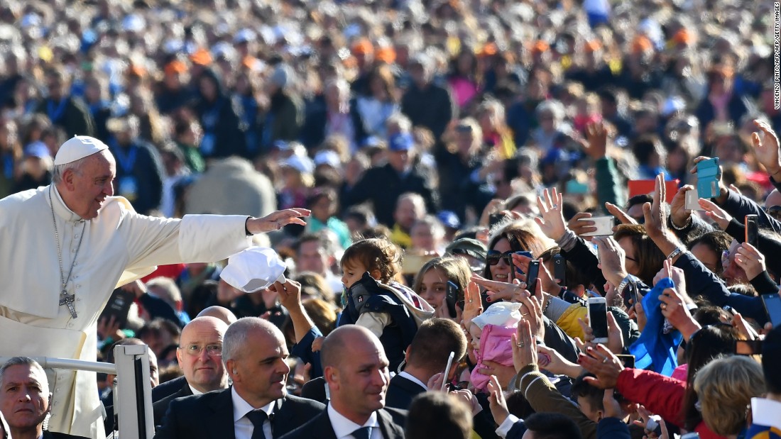 Pope Francis salutes the faithful upon his arrival in St. Peter&#39;s Square at the Vatican for the Special Jubilee Papal Audience on Saturday, October 22, 2016.
